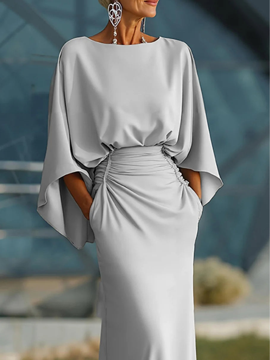 Clara | Elegante vestito con scollo a V, schiena scoperta e maniche